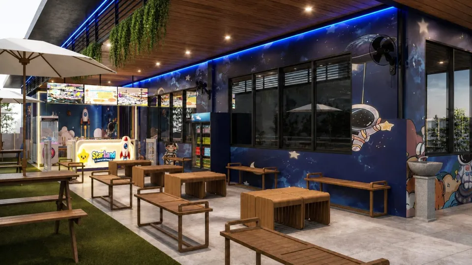 Visual area duduk dengan meja kayu dan bangku di depan playground